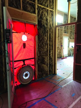 A second test is performed after the house is insulated and the windows and doors have been installed. Comparing the numbers from the two tests quantifies how much air leakage is due to the windows, separate from the shell.