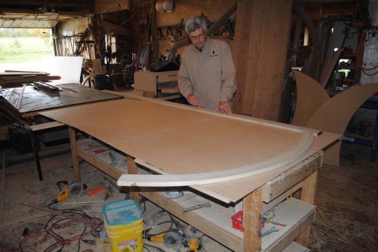 The first step in building the back panel is drawing lines for the stiles on the 1/4-inch plywood back material.