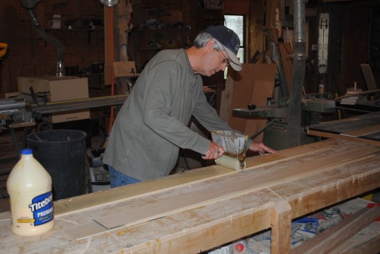 The author applies an even layer of carpenter's glue to the strips.