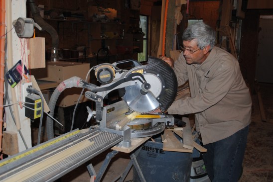 With the cut line drawn, the author simply aligns it with the laser line of the saw to make the cut.