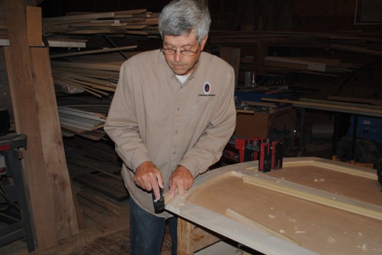 Author uses a plane to fine tune the fit of the panel molding pieces.