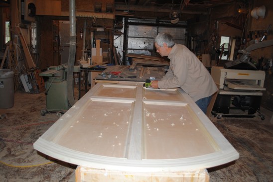 The author attaches panel molding on the bottom sections to complete the back panel assembly.