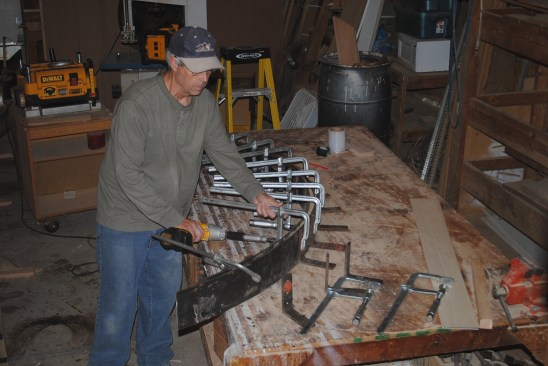 Heavy duty angle irons distribute the clamping pressure evenly over the width of the lamination. Sliding bar clamps equipped with a nut on the tightening screw make it easy to apply even pressure over the lamination using the clutch on a drill driver.