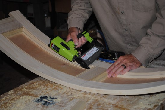 When the fit of the center stile is satisfactory, the author glues and nails it into place.