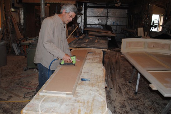 The plywood back staples to the frame.