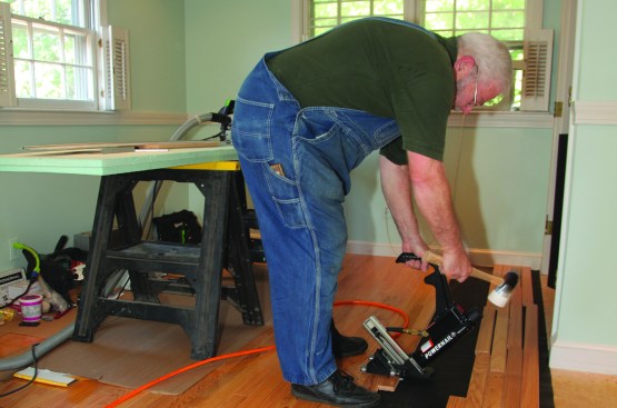 The quickest way to install the flooring is to pull the pieces over and install them in a stair-step fashion. Usually one of the crew cuts the end pieces while the other continues installing the "steps."