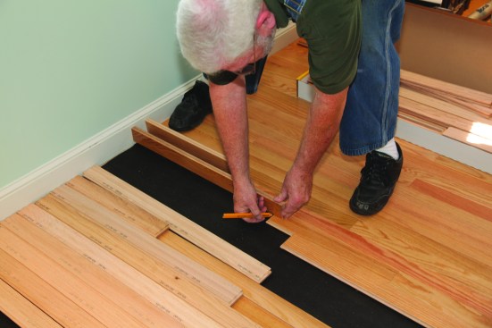 With the end pieces racked upside down and backward, they can be tilted up and the length marked on them. With the stair-step strategy, three or four boards can be marked at a time.