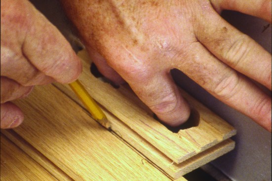 It is then planed to the scribe and installed with face nails.