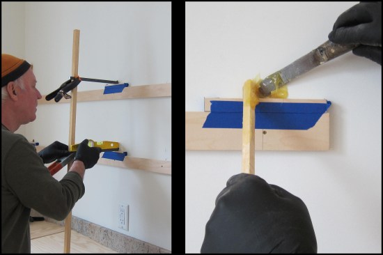 Vertical support sticks (pinned at the base with brads to keep them from wandering) and spring clamps were used to hold the steel rods
in place while the epoxy set up. Each dowel was leveled, its location scribed on the support sticks (photo, left). Once all support rod locations were dry-fit and triple-checked for level and true point-to-point sight lines, the epoxy was installed. A skinny putty knife and stick was used to fill the hole with epoxy (photo, right).