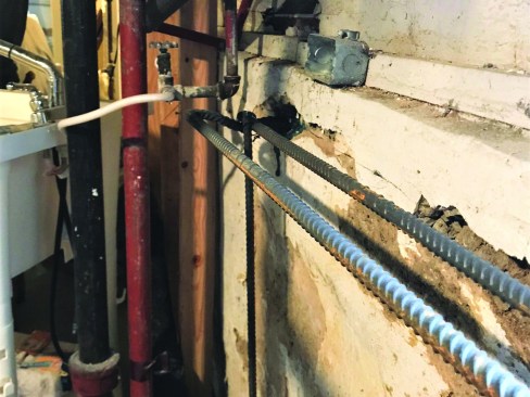 The other end of the length of rebar was bent and epoxied into the existing wall. The ends of the vertical and horizontal lengths were tied together for the pour.