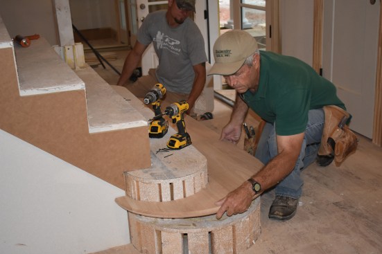 Because of the size of the bottom tread and the double radius, a crew member lent a hand to drop the tread into place.