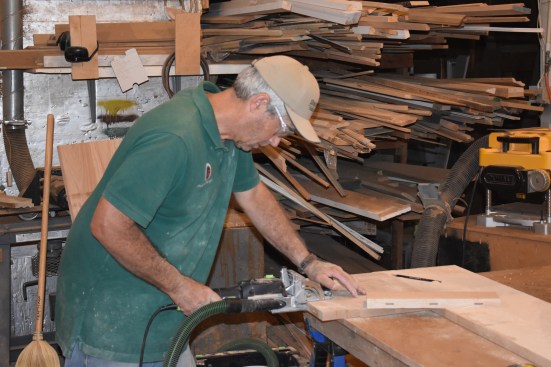 The bottom tread was too wide to go through the 24-inch planer, so after the initial glue up and planing, the author added on a piece for the final width, using biscuit joinery to attach the final strip.
