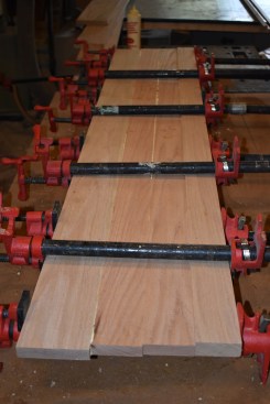 The outer edge of the tread that stepped off the landing was straight so the author used full length strips to make the blank. Because of a discrepancy in the stair fraiming, he had to use 3/4-inch thick stock for the main tread, and then added a 5/4 strip on the leading edge to keep the look consistent. 
