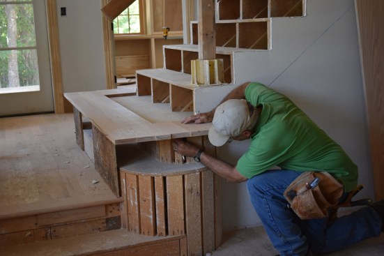 The author had to scribe and cut the inside radius first before he could scribe the outside. He set the lower blank on top of the upper riser propping it up level to scribe the radius. 