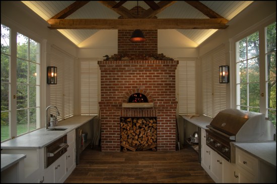 In the completed interior, the wood-fired oven serves as the focal point of the summer kitchen.