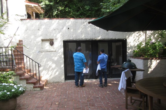 The attached masonry structure was built into a hill behind the home.
