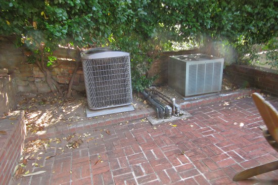 AC coolant and power lines fed downward through concrete deck caused leaking to the interior.