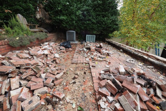 Demolition of the brick patio revealed an underlying concrete slab.