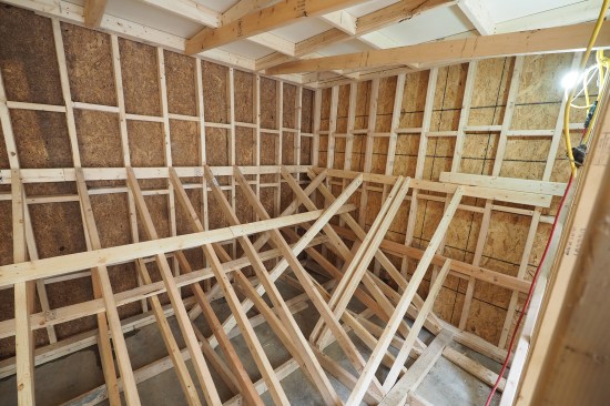 Due to the nonstandard wall height, custom single-sided formwork was built on site. 