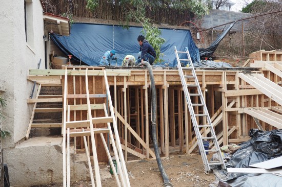 The liner walls were poured using a 3-inch hose with pea-stone gravel mix to facilitate flow in the rebar-filled cavities.