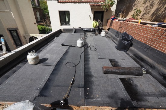 The previous roof was asphalt; a torch-down roof system was installed to avoid any compatibility issues with asphalt and single-ply systems. 