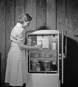 Fresh milk is put in a Frigidaire cooled with Freon circa 1940.Photo courtesy of the Library of Congress.