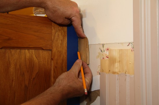 He does the same thing along the end panel’s stile and rails as well. He likes to put tape on the surface of darker woods to better see his mark and also to help prevent tear-out.