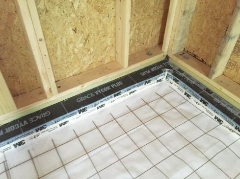 Steel reinforcement mesh was placed atop the poly before the pour.