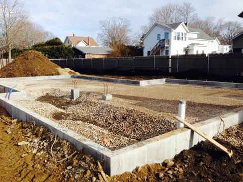 Fill was used to put the slab at a height roughly 16 inches above the surrounding grade to minimize the risk of problems from groundwater.
