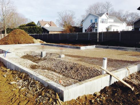 Fill was used to put the slab at a height roughly 16 inches above the surrounding grade to minimize the risk of problems from groundwater.