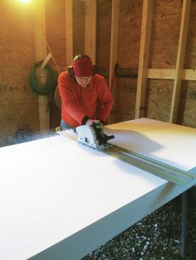 To cut the 6-inch EPS sheets, a worker first sawed through from both sides using a Festool track saw.

