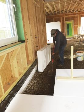 A shovel is used to flatten the smoothed stone.