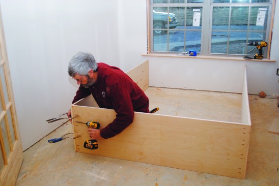 The cabinet for the bed was a three-sided box (a top and two sides) pocket-screwed together.