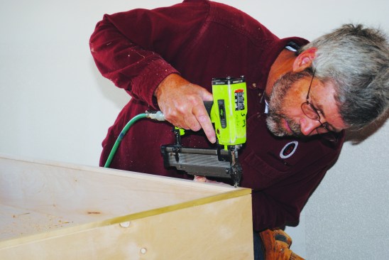 Because the edges of the platform are exposed when the bed is folded down, I covered them with 3/4-inch by 3/4-inch-thick pieces of solid-wood trim.