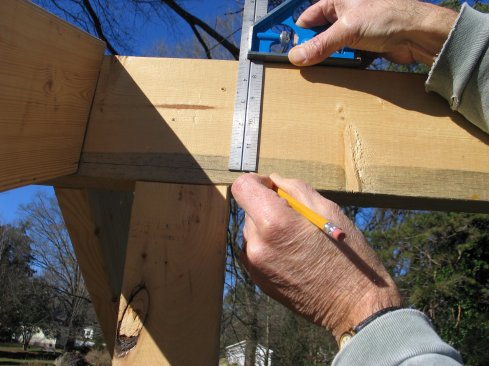 Mark that distance down from the top of the ridge. This is where the upper long point of the gable plate will land.
