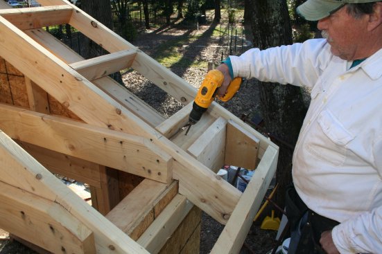 Before the roof sheathing goes on, the open framing provides easy access for attaching the return blocking and the nailers for the rake soffit.
