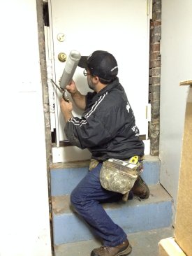 Low-expansion foam sprayed between the foundation and the jamb air-seals around the new door.