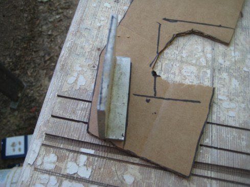 The template now bears the lines for tracing the shape of the post using the aluminum angle.