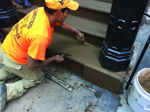 The finish coat—a colortinted cement-based mortar— goes over the scratch coat and is finished with trowels, levels, and sponges.