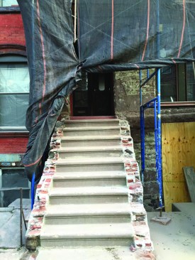 Some stairs were designed with closed stringers composed of a brick
and brownstone mixture.