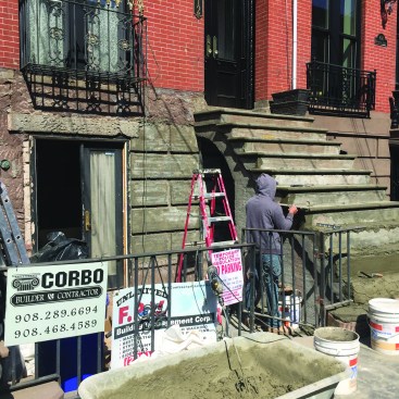 With little more than trowels and straightedges, the skilled crew sculpts a new set of stairs from a well-compacted build-up of the repair mortar.