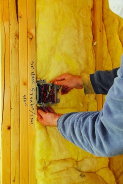 After pressing the inside layer into place, cut around the switch box for a snug fit.