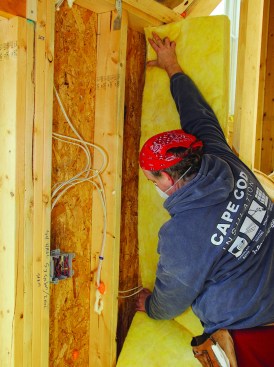 To fit insulation around simple wires traveling across a bay, pinch the batt at the height of the wire.
