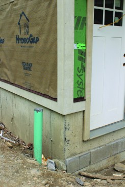 Thin concrete block raises the stone shelf cast into the foundation closer to grade.