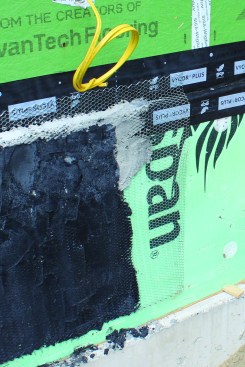Flashing tape protects the bottom of the sheathing behind the metal lath.