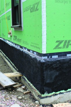 The black scratch coat provides a dark background for the “dry-laid” stone.