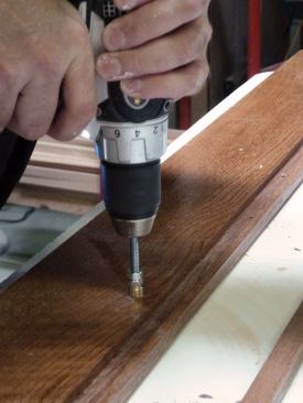 With the drill on a low-speed setting, we carefully spun each insert into its hole, taking care to drive them in perpendicular to the face of the door.