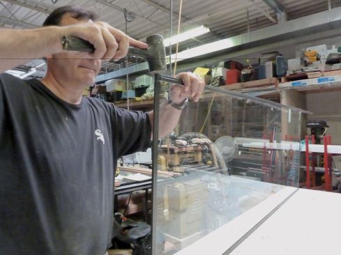The glazing extrusion is similar, except that a stepped rubber gasket inside the extrusion holds standard tempered glass securely.