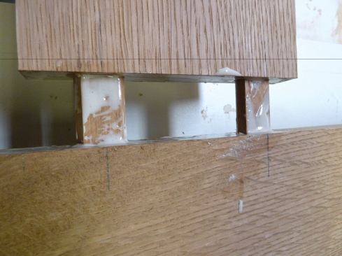 Because storm doors are exterior doors, always use a waterproof glue, such as Gorilla Glue or Titebond III. We spread glue on all mating surfaces, including the tenons (4), and placed the assembly on bar clamps at each end of the door.