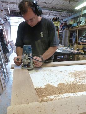 Then we routed a 1/2-inch–wide rabbet around the inside of the frame (6). This rabbet would receive the interchangeable screen and glazed panels, so its depth was dictated by the thickness of the aluminum channel that held the panels—about 3/8 inch in this case.